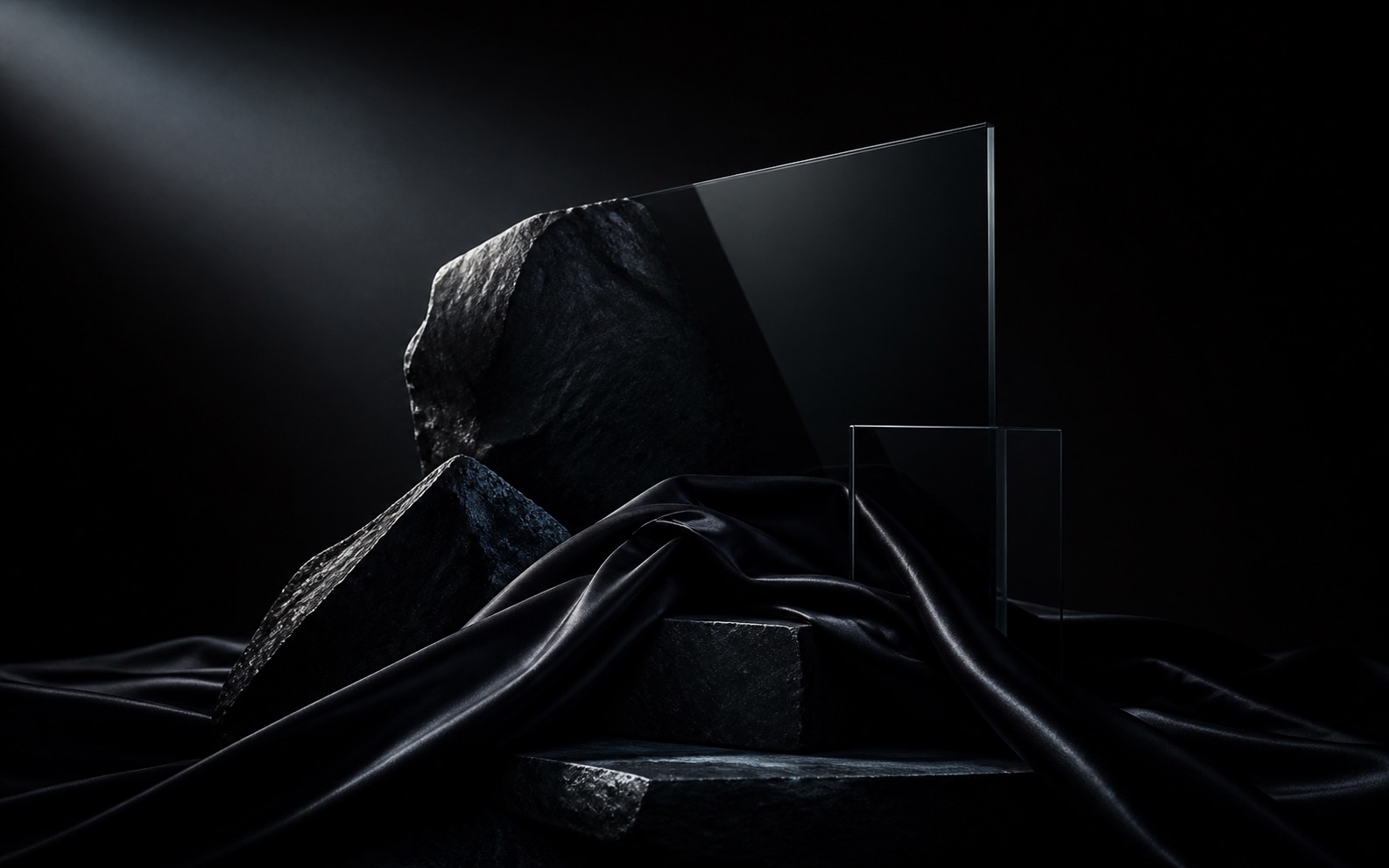 Premium black image with graphite stone, black silk, glass planes, and cinematic edge light
